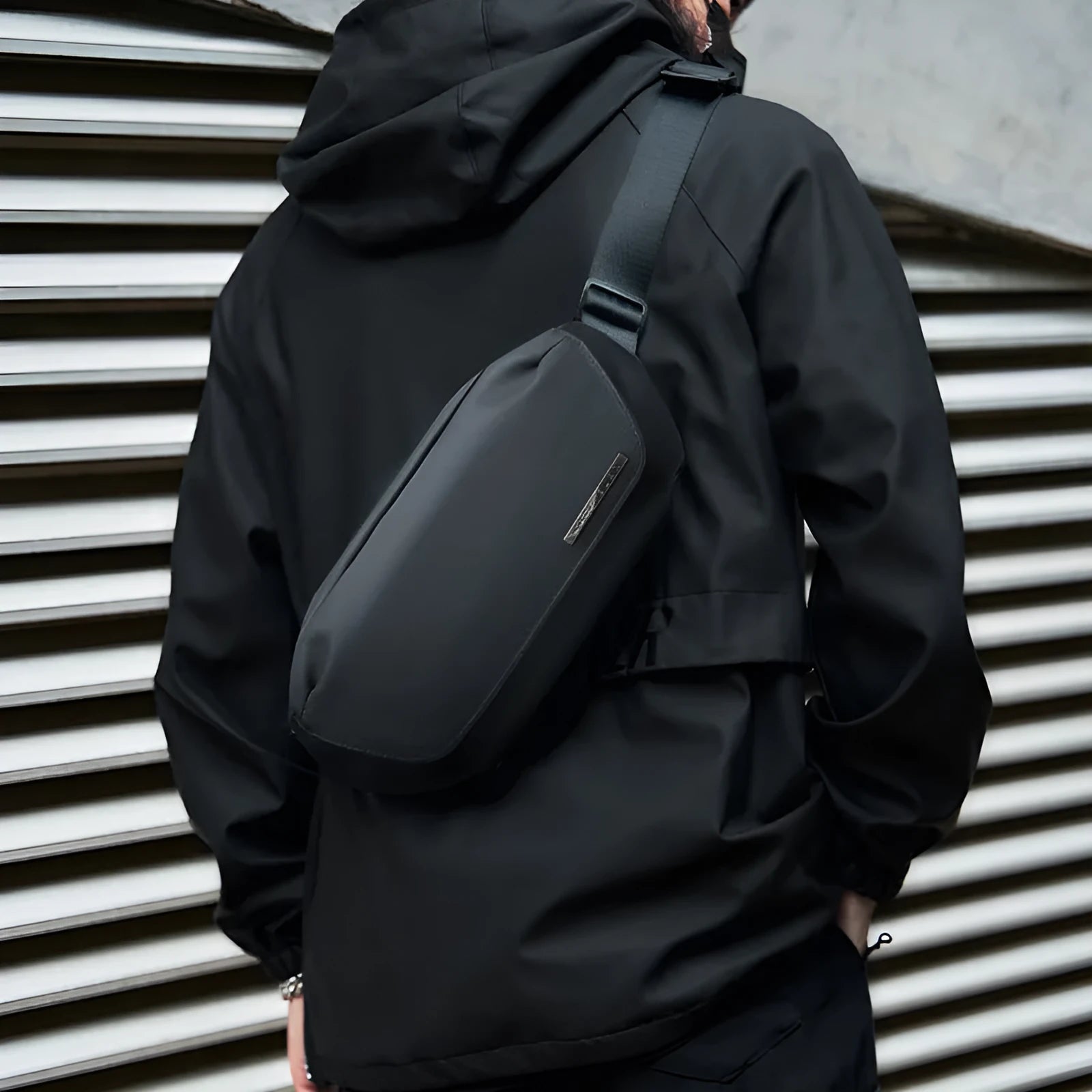 Black men's messenger bag with Oxford cloth construction for one-shoulder riding