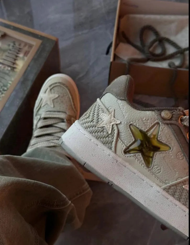 Green low-top casual shoes with star pattern detail and a thick rubber sole