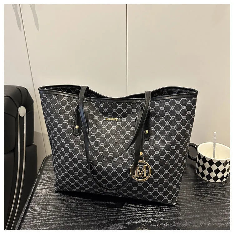 Western style black PU leather shoulder bag with adjustable strap and sewing thread detail.