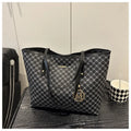 Western style black PU leather shoulder bag with adjustable strap and sewing thread detail.