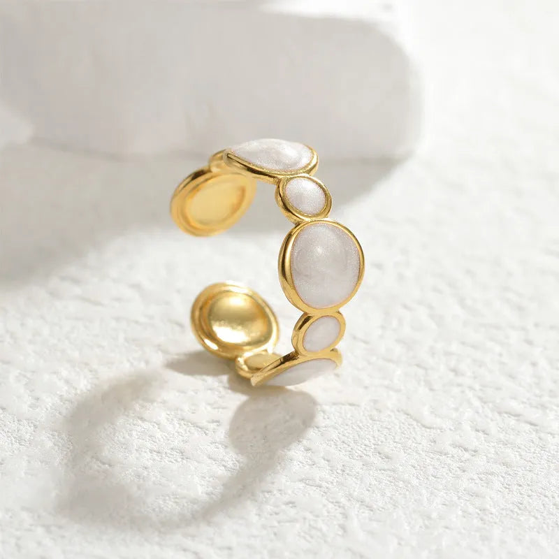 Adjustable geometric stainless steel ring with an electroplated finish for women.