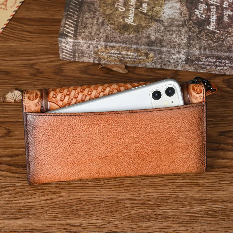 Retro brown embossed Chinese floral pattern tri-fold leather wallet open showing interior compartments.