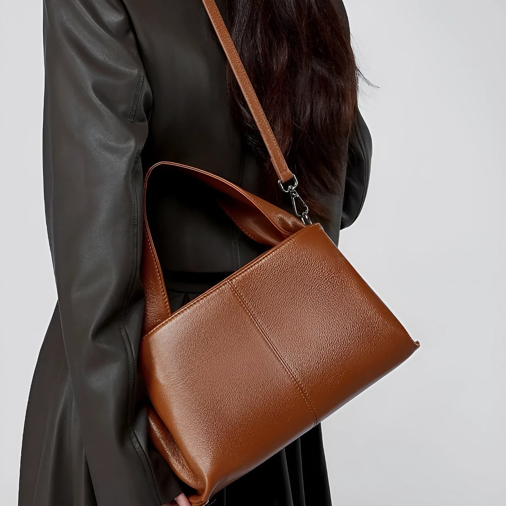Genuine cowhide leather messenger bag in urban style with sandwich pocket and double straps.