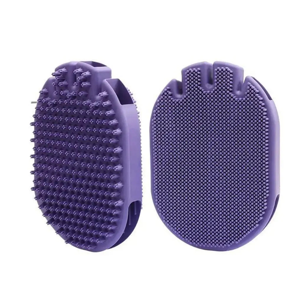 Purple dual-sided pet shampoo and massage brush with soft TPR bristles and ergonomic handle.