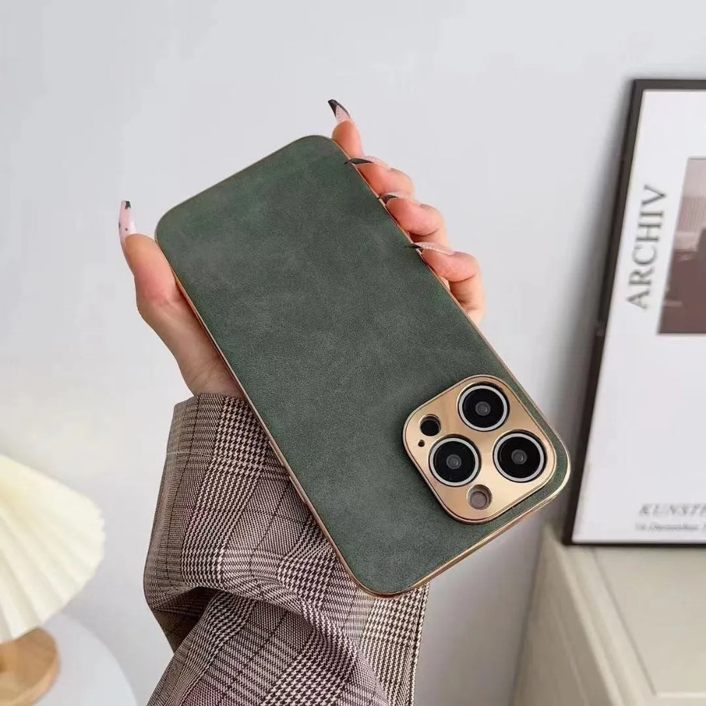 Leather texture solid colour phone case for iPhone on a table, showing black, blue, grey, and grey-green colour options.
