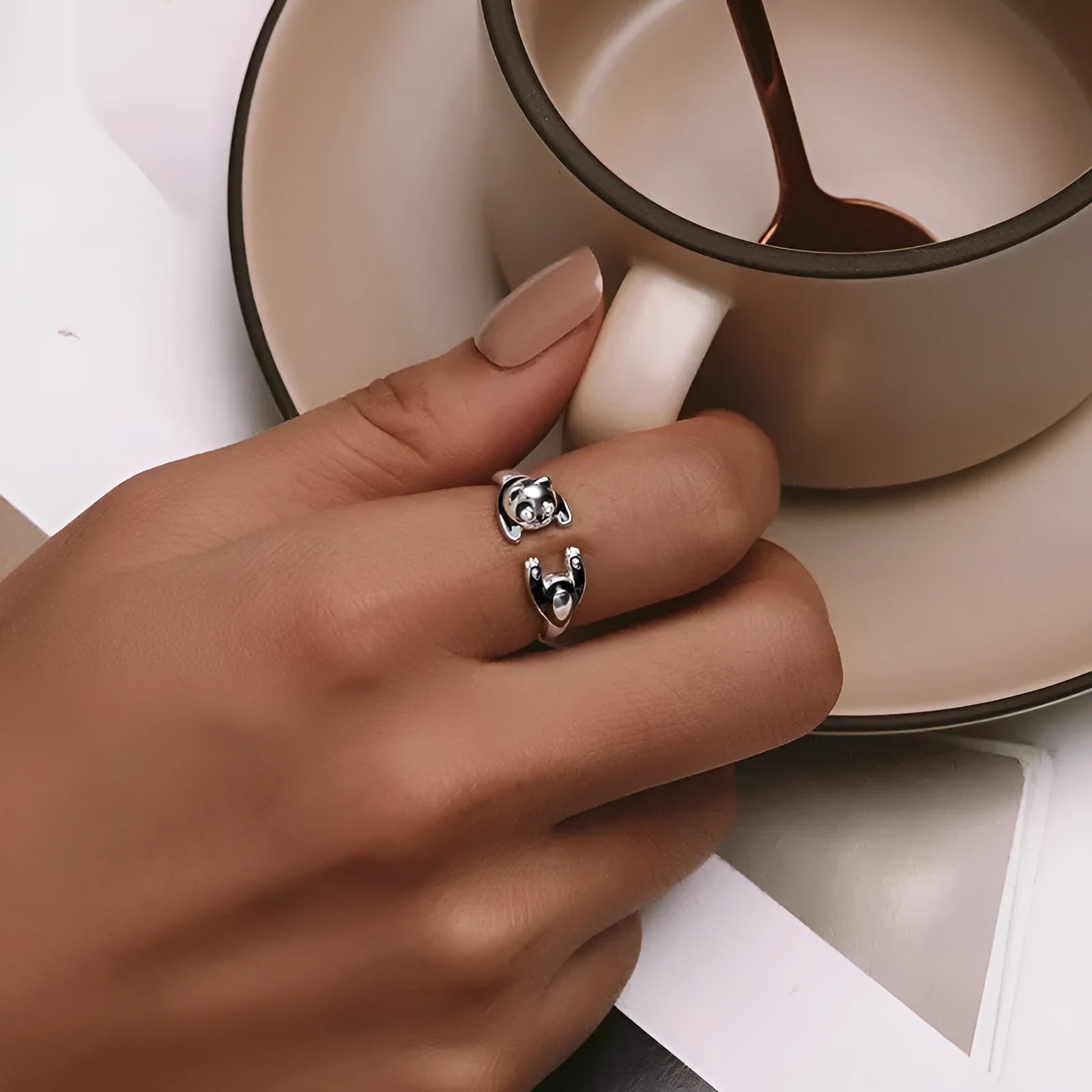 Adjustable sterling silver ring with a white gold plated panda design.