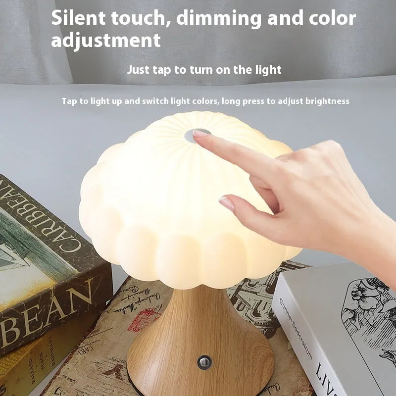 Mushroom-shaped touch control table lamp with USB charging port in wood grain colour.