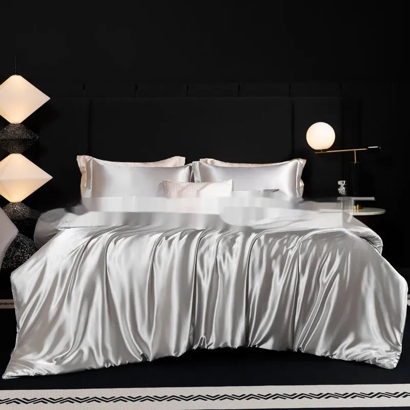Personalised solid colour silk bed sheet four-piece set shown in multiple colour options.