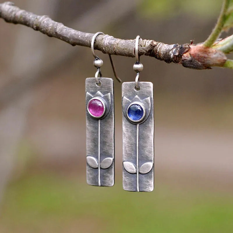 Antique finish red sapphire earrings with geometric shape and elliptic design elements
