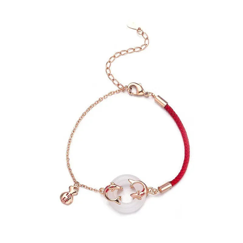 Festive koi bracelet with peace buckle charm on red rope, featuring fish tail decorative elements in Japanese style