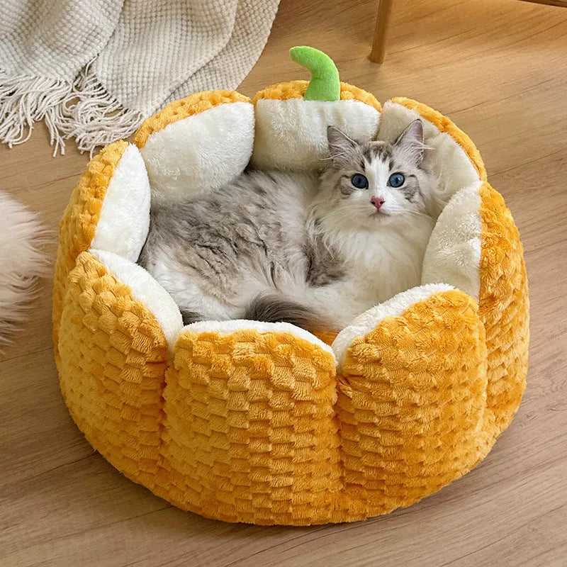Pumpkin-shaped pet bed with raised sides and cotton filling for cats and small dogs