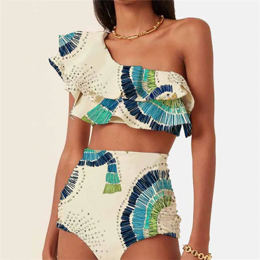 White women's one shoulder swimsuit with a layered lotus leaf skirt and a thigh high split.