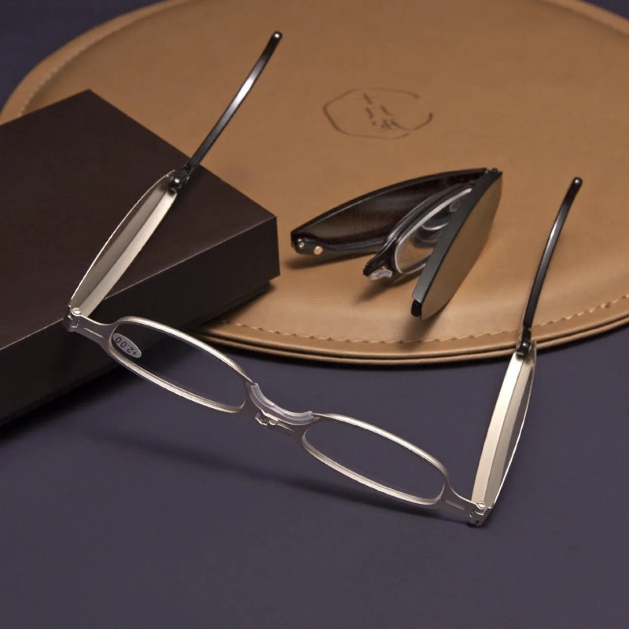 Folding presbyopic glasses with retro ring style frame shown in black and silver colour options