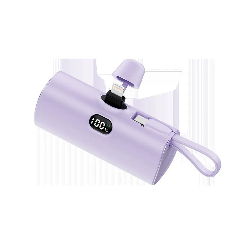 Compact capsule-shaped wireless power bank with digital display and integrated plug in multiple colours.