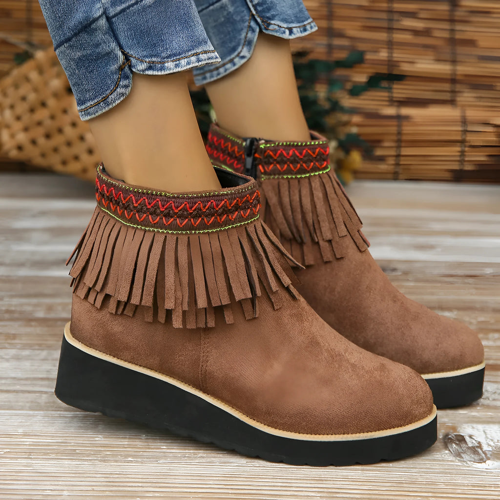 Women's dark brown suede wedge ankle boot with side zipper, tassel, and thick waterproof platform sole.