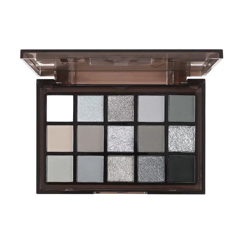 15-colour eye shadow palette with earthy tones and cartoon designs showing shimmer matte finishes