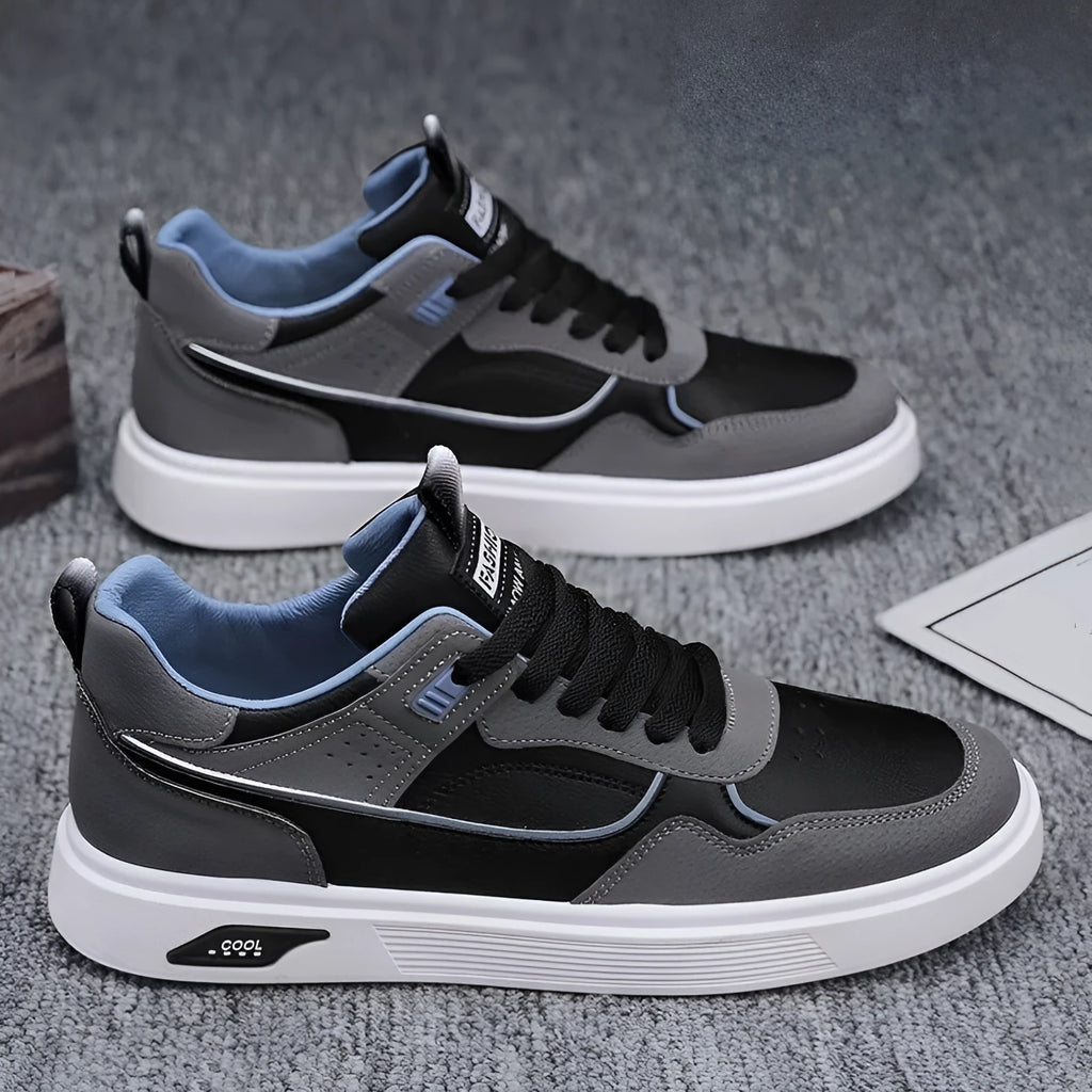 Men's low-top canvas board shoes in black, beige, and grey with mesh lining and leather stitching.