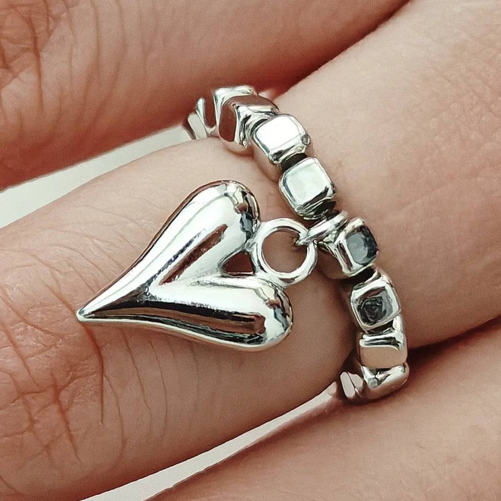 Handmade beaded elastic string love ring with geometric heart design in gold or white colours