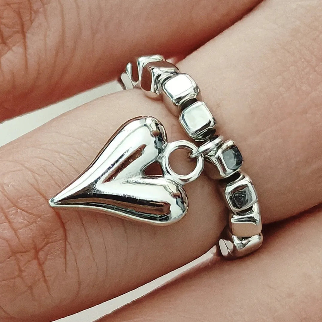 Handmade beaded elastic string love ring with geometric heart design in gold or white colours