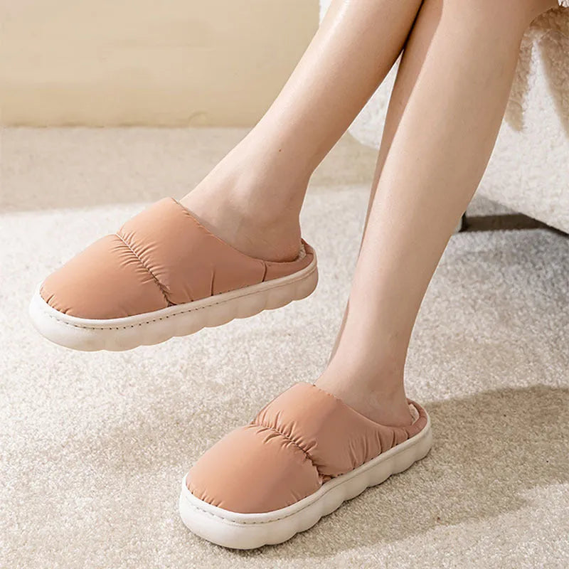 Blue down cotton slippers with thick rubber sole and plush lining, shown from side.