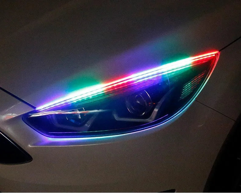 Colourful RGB LED daytime running light strip with remote control for vehicles.