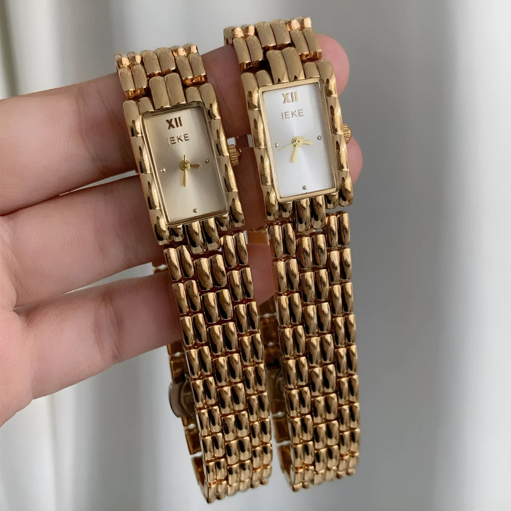 Women's bracelet watch with butterfly clasp showing 15mm dial and stainless steel case