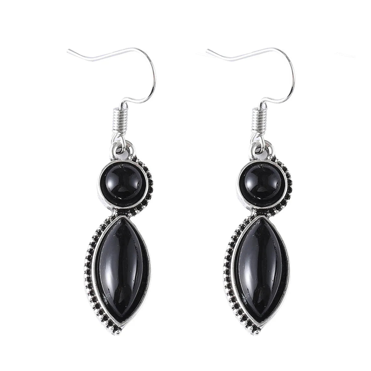 A pair of vintage-style geometric drop earrings in black and purple with a round element, bohemian jewellery.