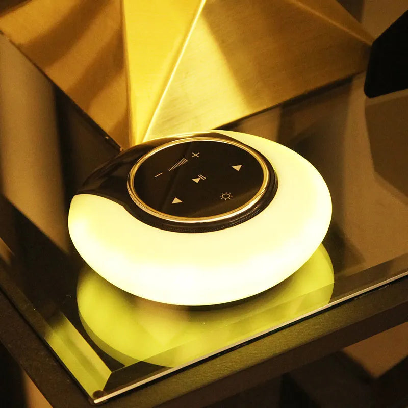 Blue Bluetooth desk lamp speaker with folding design and touch controls showing LED lighting