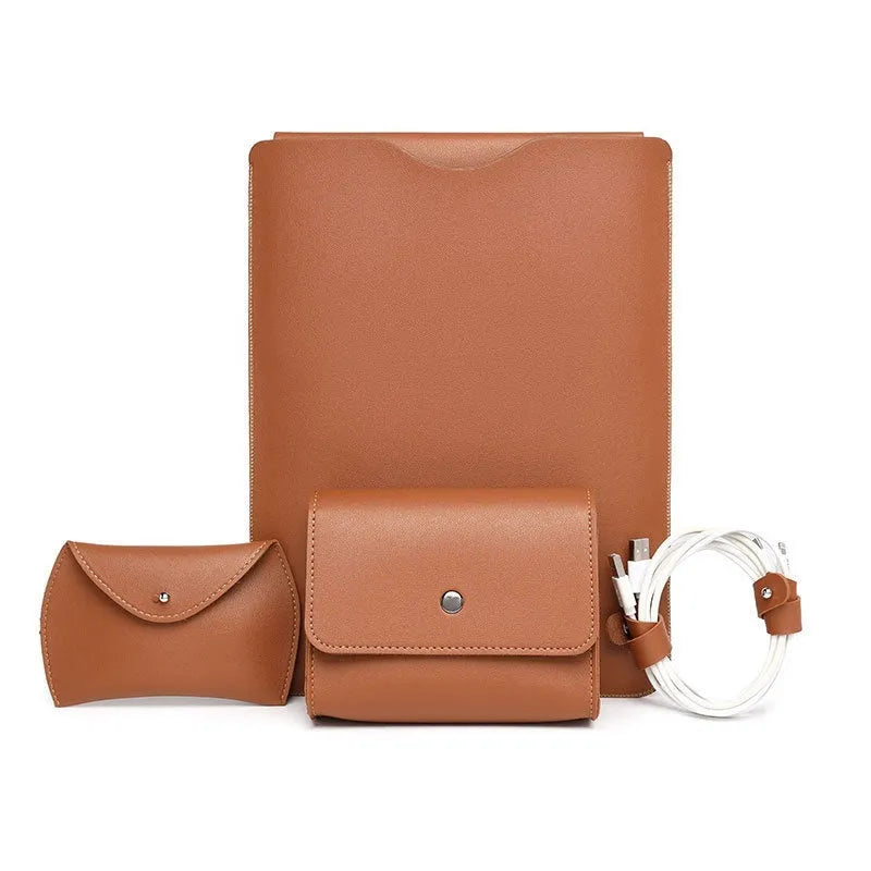 Set of four brown imitation leather laptop corner protectors on a grey laptop.