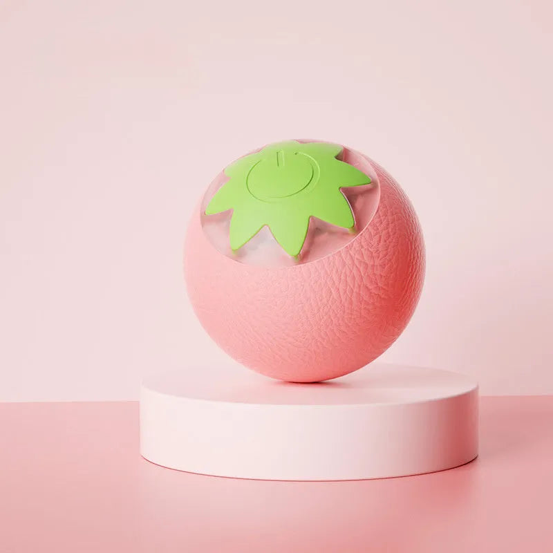 Automatic electric rolling ball pet toy for dogs and cats, 4.5cm cube in green, pink, or yellow.