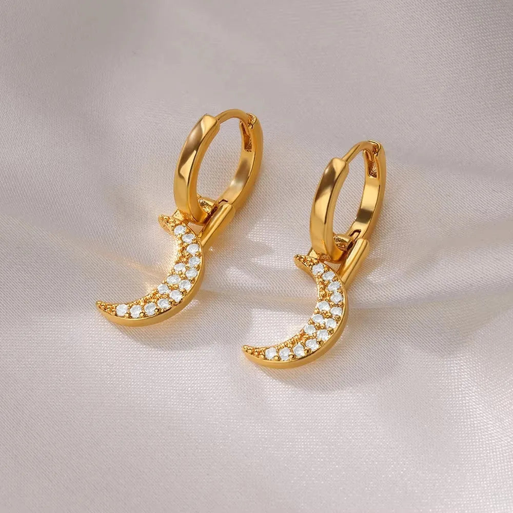 Women's copper butterfly earrings with geometric heart and star shapes.