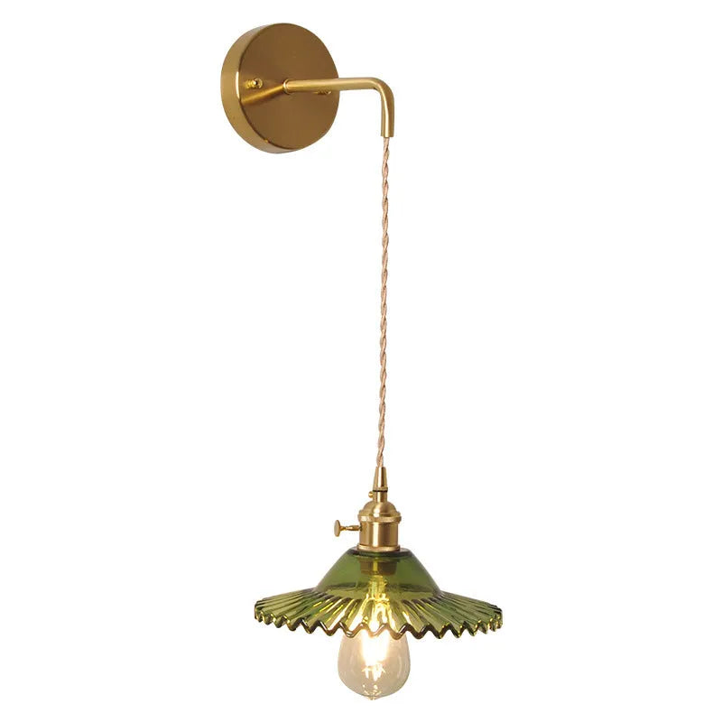 Brass-coated lotus wall lamp with a glass shade on an adjustable wire, shown in a white colour variant.