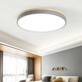 Nordic style round ceiling lamp made of solid wood and iron with a white finish.