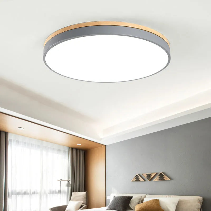 Nordic style round ceiling lamp made of solid wood and iron with a white finish.