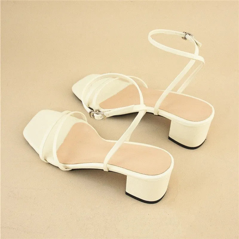Beige women's stiletto sandals with chunky block heel and square toe design, showing adjustable ankle buckle closure
