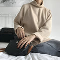 Women's loose fit long sleeve top with a half-high collar in white, apricot, or black.