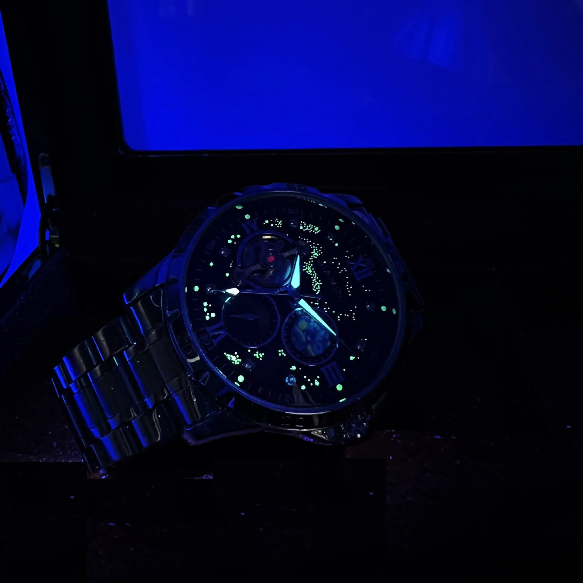 Automatic mechanical men's watch with rose gold case, black dial, and large display.