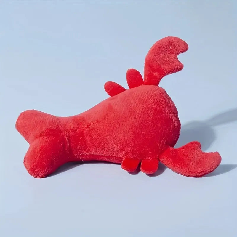 Red lobster-shaped squeaky dog toy with crab-lobster design measuring 12.5cm long
