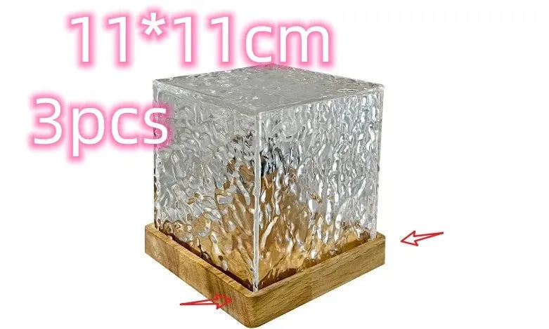 USB-powered crystal table lamp projecting blue water ripple light patterns on a wall