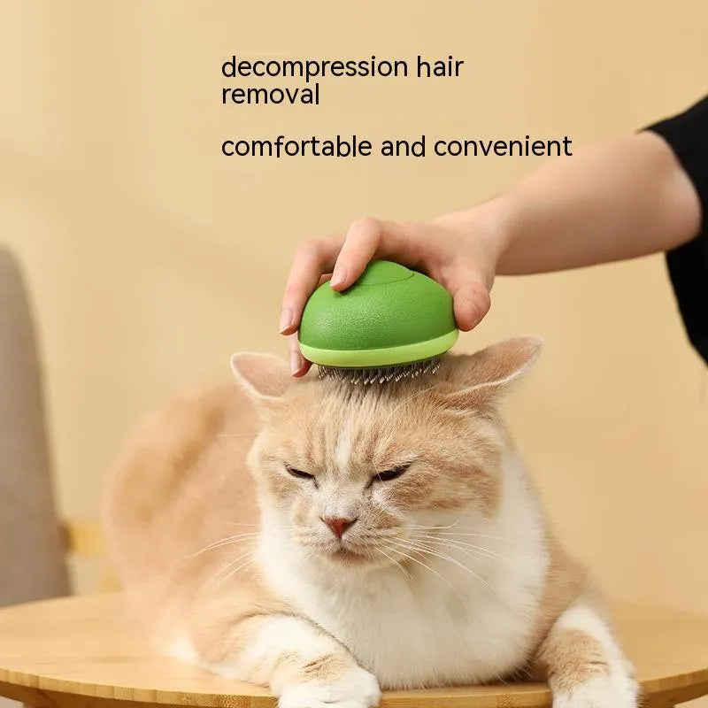 Avocado-shaped cat brush in avocado green with stainless steel needles