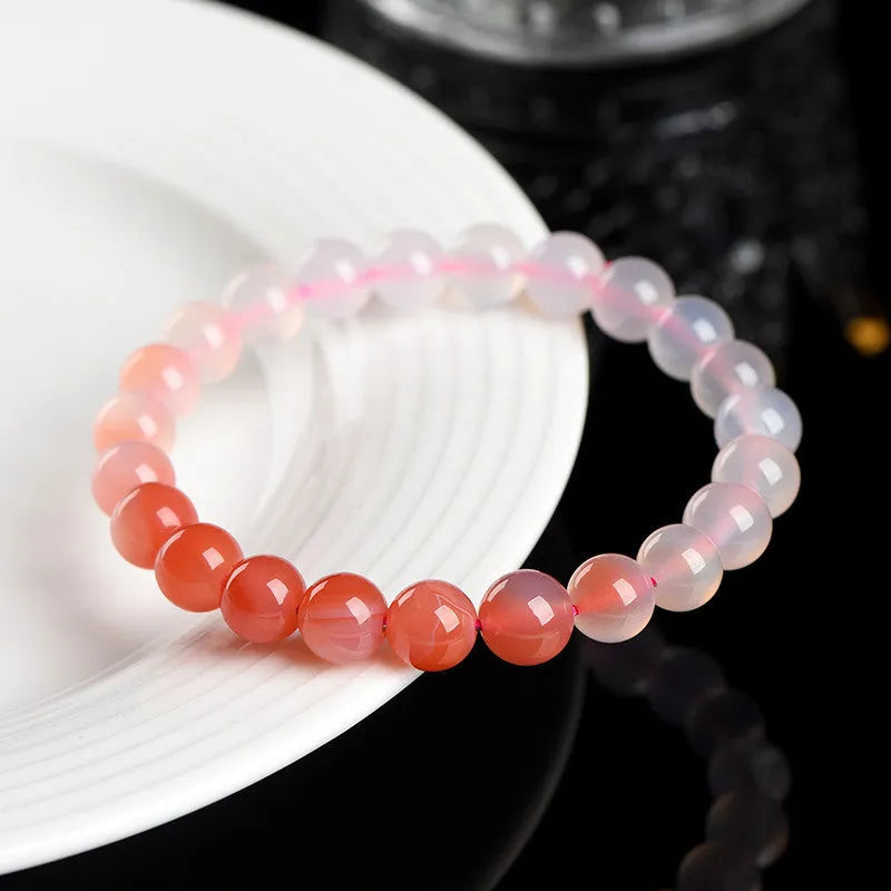 Yanyuan Agate bracelet with gradient salt source colour on wrist, showing geometry-shaped beads.