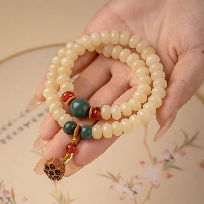 Wooden bracelet with flat round cream topaz beads for a 15-20cm wrist.