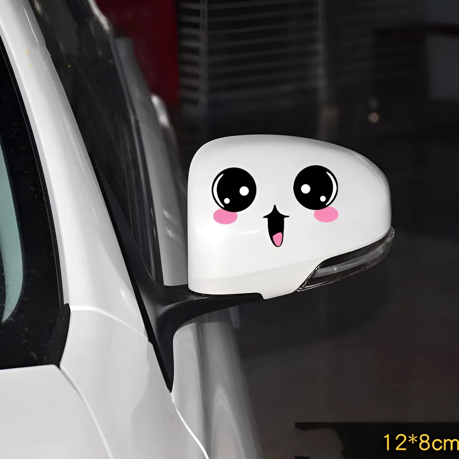 Pair of reflective cartoon car stickers with cute eye designs on a white background.