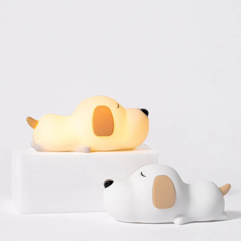 Cute two-tone cartoon dog silicone night lamp with USB cable for charging.