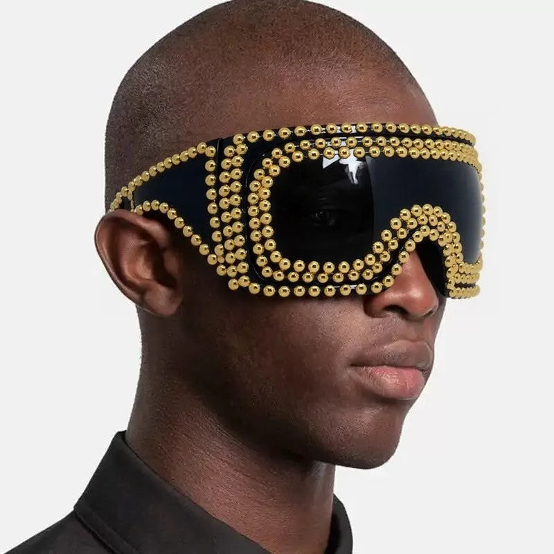 Men's punk-style sunglasses with large rim and square rivets in silver and gold colours