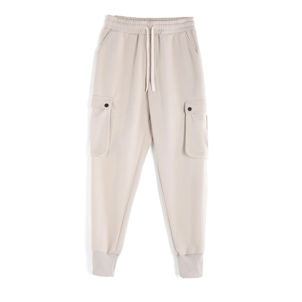 Men's loose cotton ankle-tied sport trousers in a solid colour with multiple pockets.