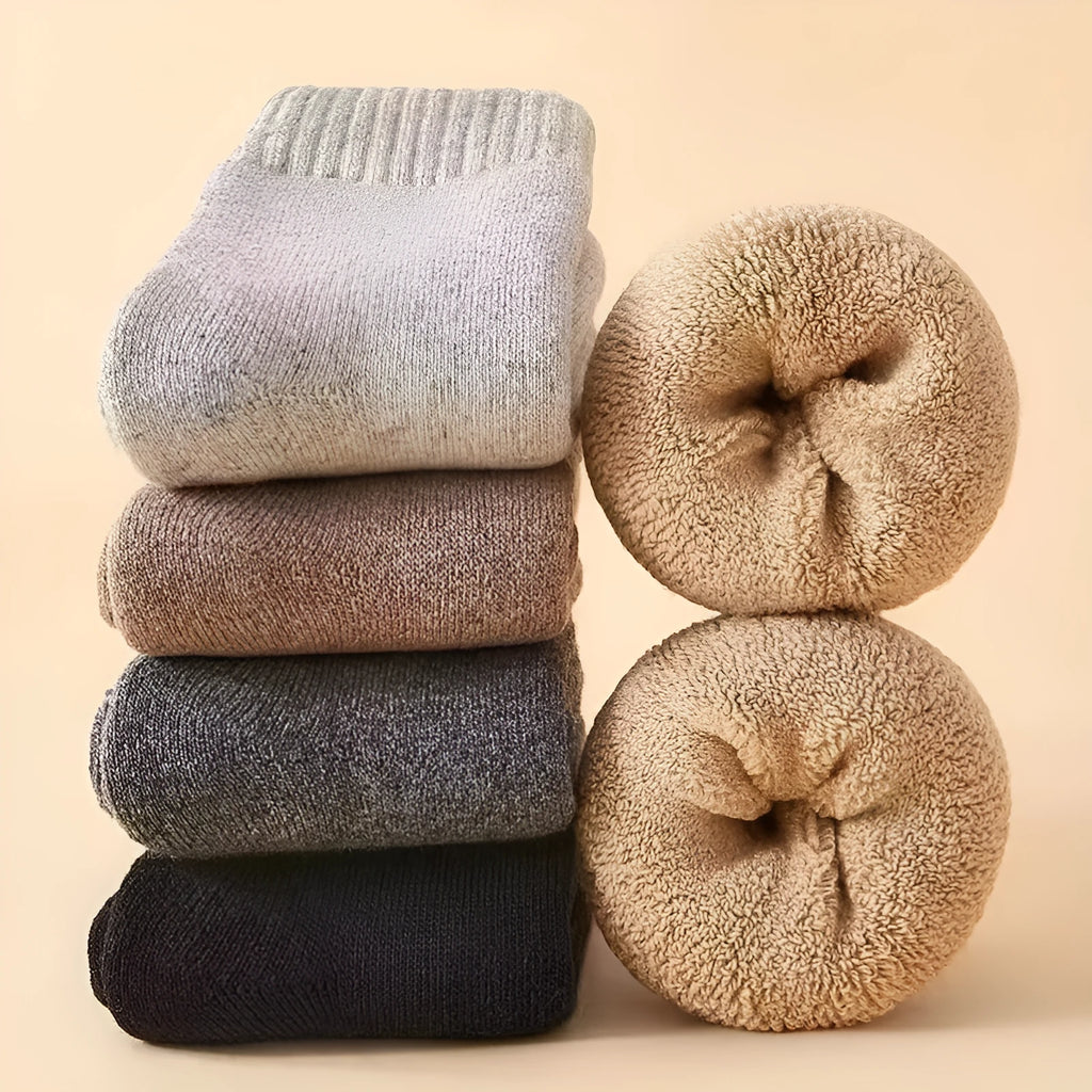 Pair of thick wool winter socks with a Merino midsole in a solid colour.