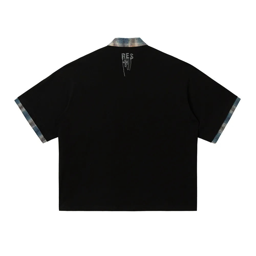 Men's loose blue cotton short-sleeved top with asymmetric lapel and graffiti print detail.