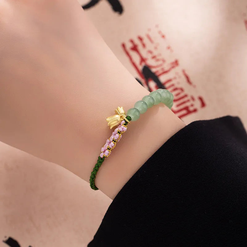 Hand woven red rope bracelet with lily floral design in national style