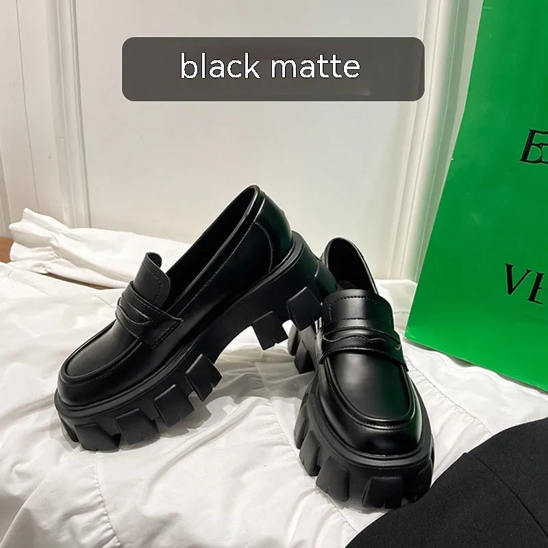 British style wide fit loafers with chunky rubber sole and muffin heel in patent leather.